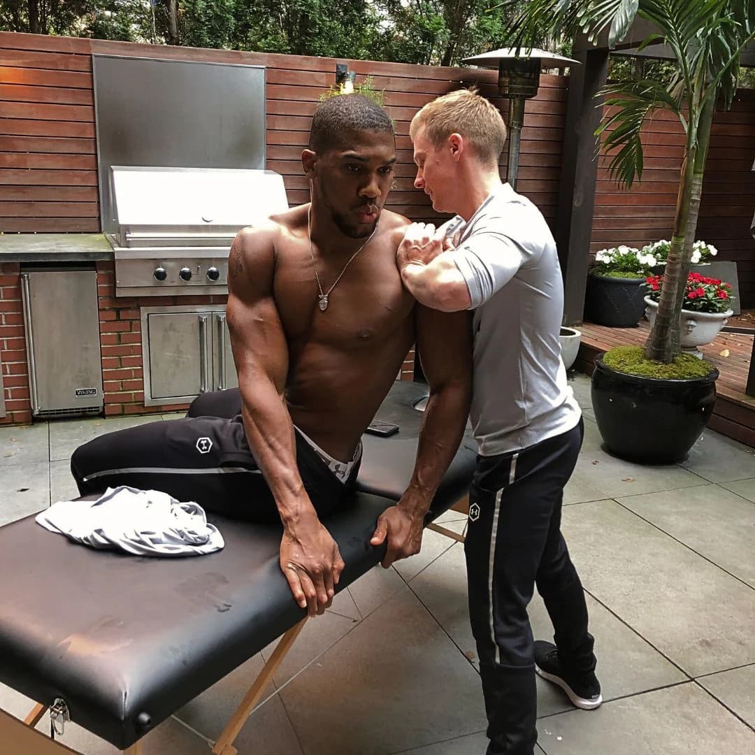 Two women in a wellness setting practicing yoga and meditation